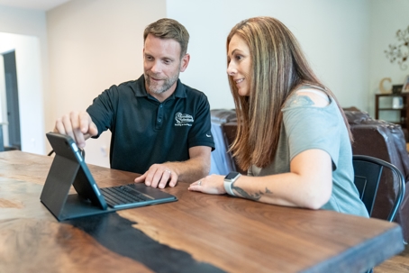 Patrick Chafin (GM) consulting with homeowner